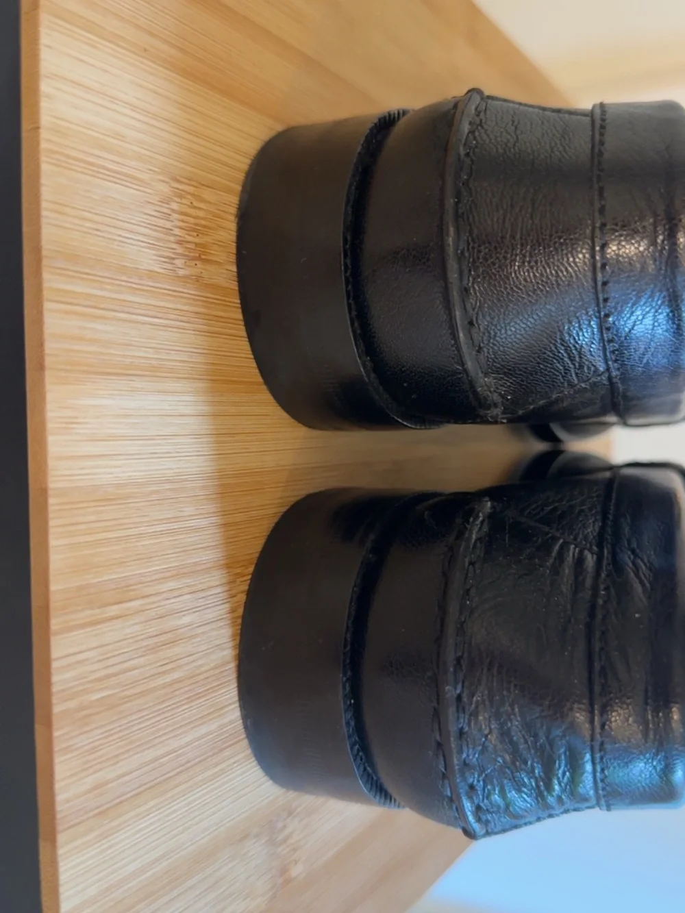 Gucci Black Leather Men’s Slip-On Loafers with Gold Logo Band